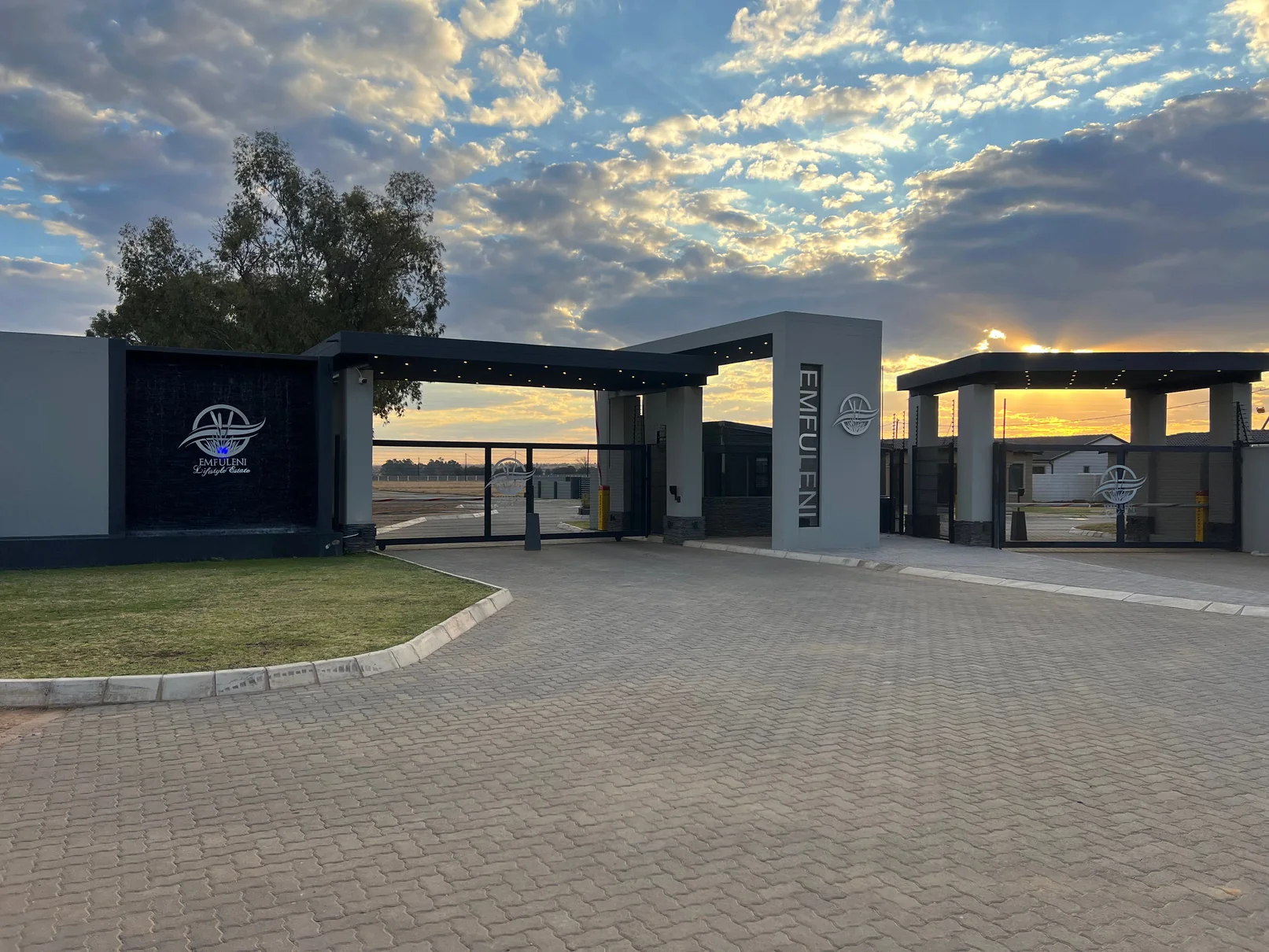 Residential estate entrance and completed homes